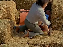 Lovely babes were making love in the hay, when their friend showed up and joined them