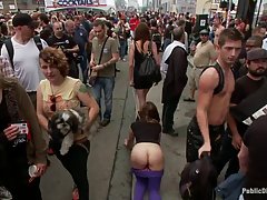 Kinky girl was tied up in the street and spanked in front of many people