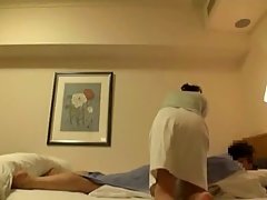 A married couple is in a hotel room and having sex in front of a hidden camera