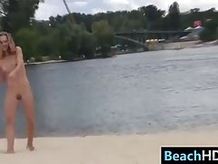 Nude babes are having a lot of fun on the beach, in the middle of the day