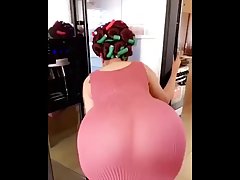 Voluptuous woman in sheer dress is showing her ass to the camera, just for fun