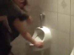 German woman is getting banged in the public toilet after she is done with sucking hard dick