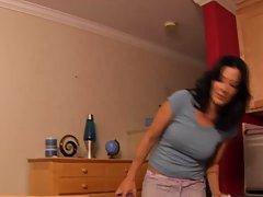 Dark haired woman is rubbing her lover's dick, because she likes to keep him satisfied