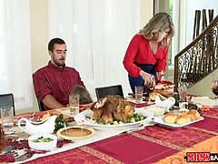 Blonde woman in red dress is about to have group sex after a tasty dinner