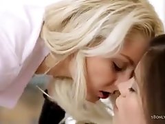 Two lovely girls are pampering each other in the bedroom, in every way they know